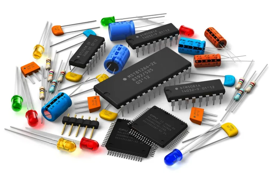 Various electronic components ready for PCB assembly.
