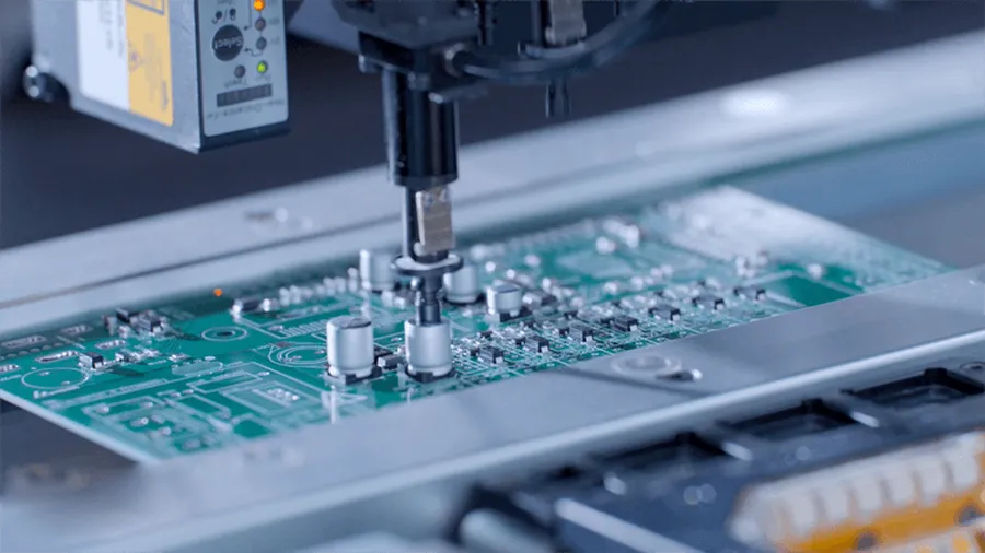 A PCB with surface mount components being assembled.