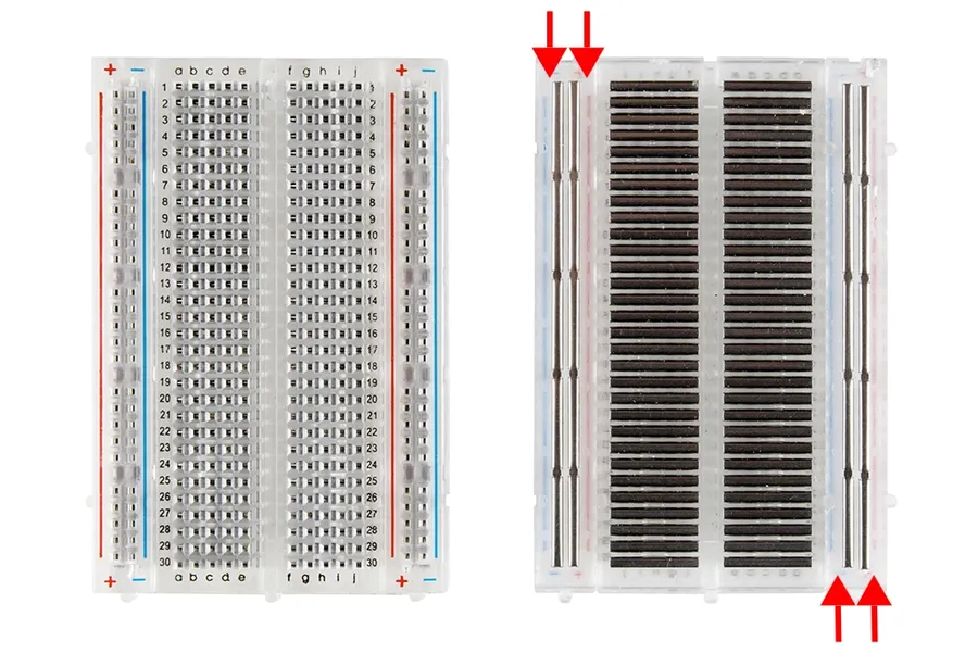 Close-up of a solderless breadboard showing its internal structure with rows and columns.
