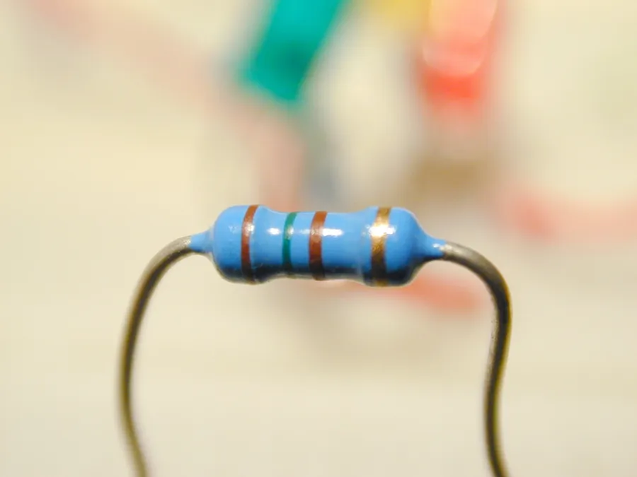 A detailed view of a resistor showing its body and leads.