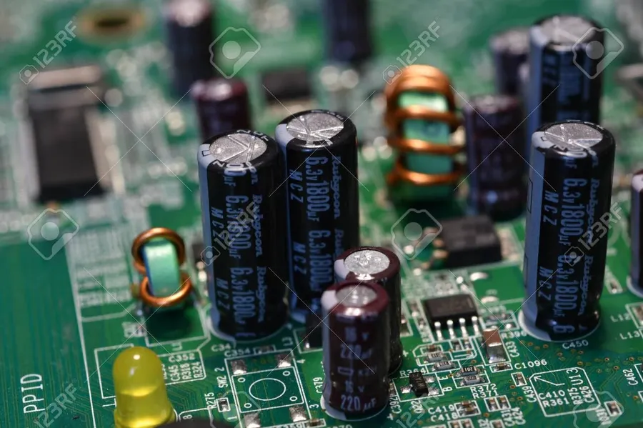 A close-up view of various capacitors on a motherboard.