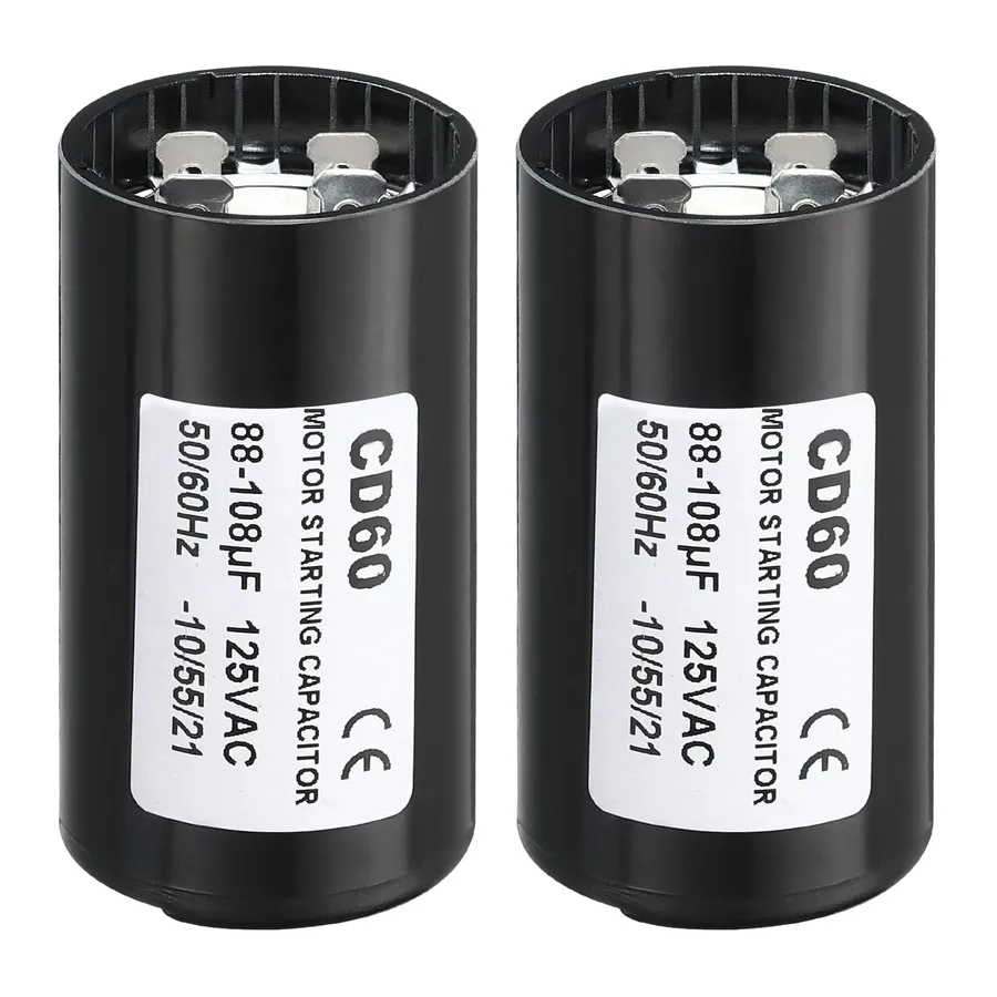 A close-up of different types of capacitors used in compressor systems.