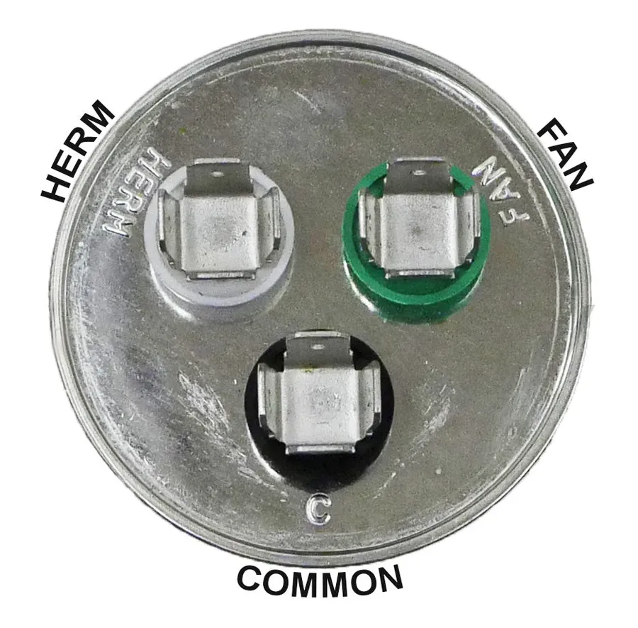 A person replacing a dual run capacitor in an AC unit.