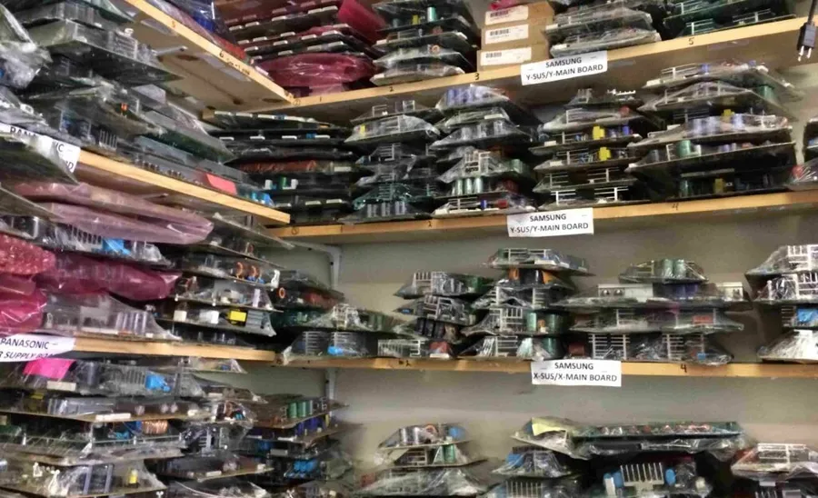 A view inside an electronic component store, with shelves of parts visible.
