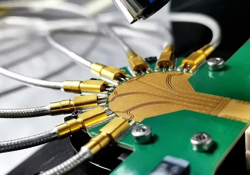Technician performing functional tests on a PCB board