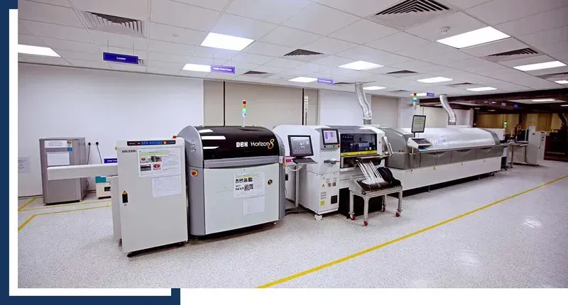 An SMT machine placing components onto a PCB during assembly