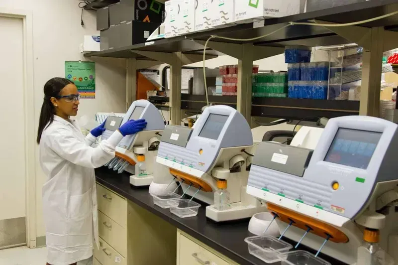 A technician performing quality testing on a medical device