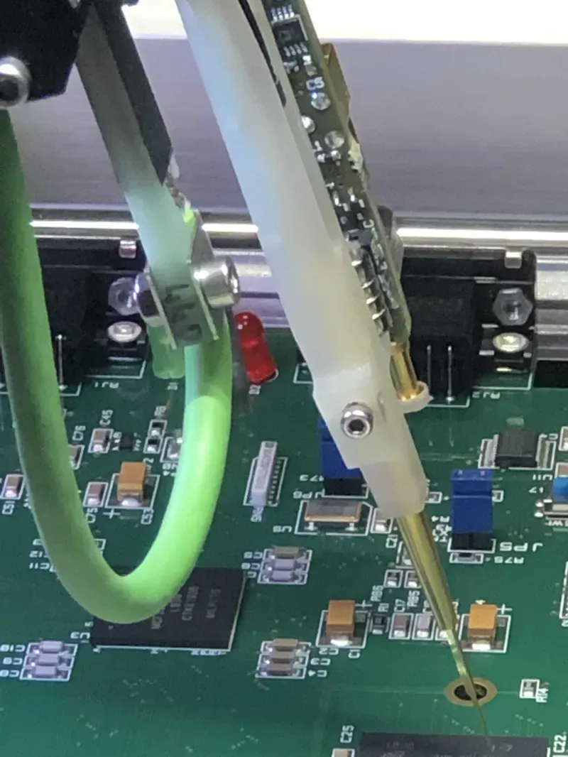 An engineer testing a screen door control board